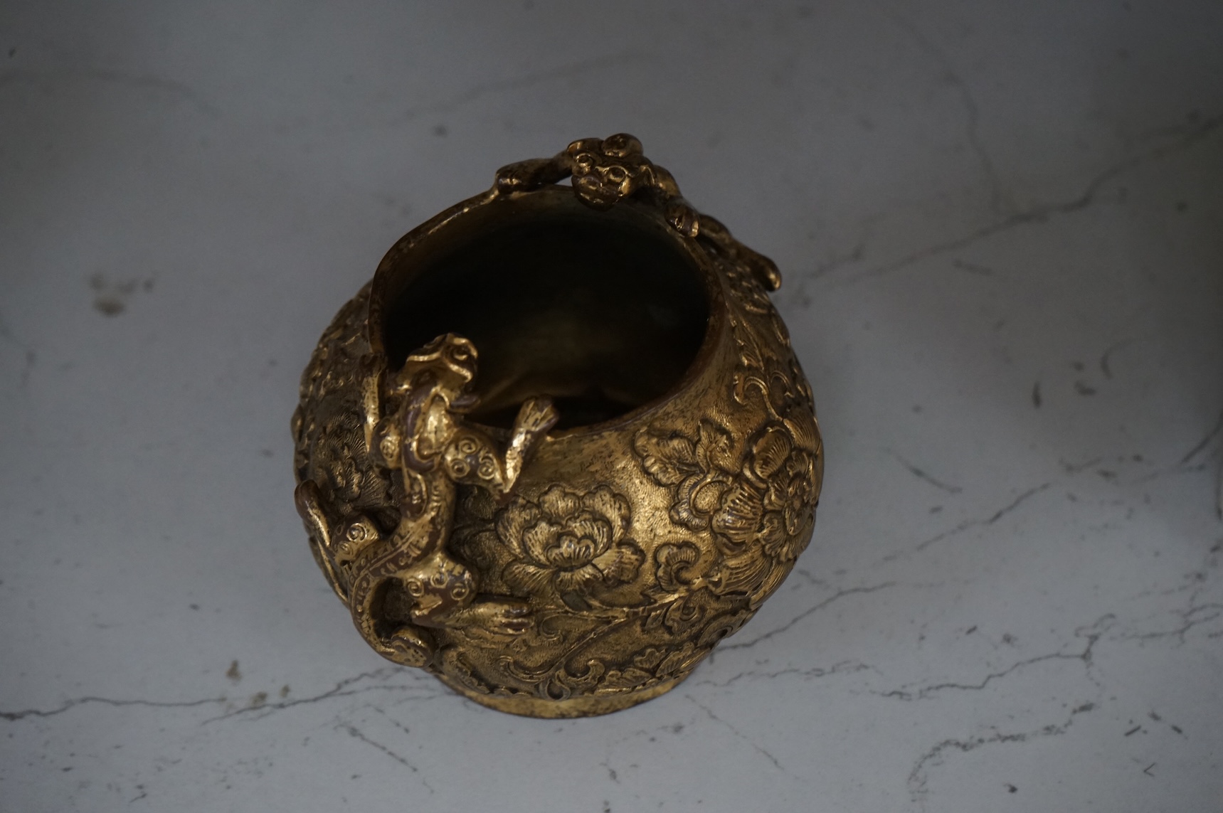A Chinese gilt bronze vase decorated with applied lion dogs, 7.5cm high
